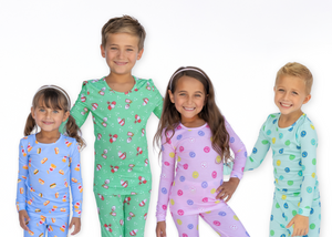 Five children wearing colorful pajamas on a white background