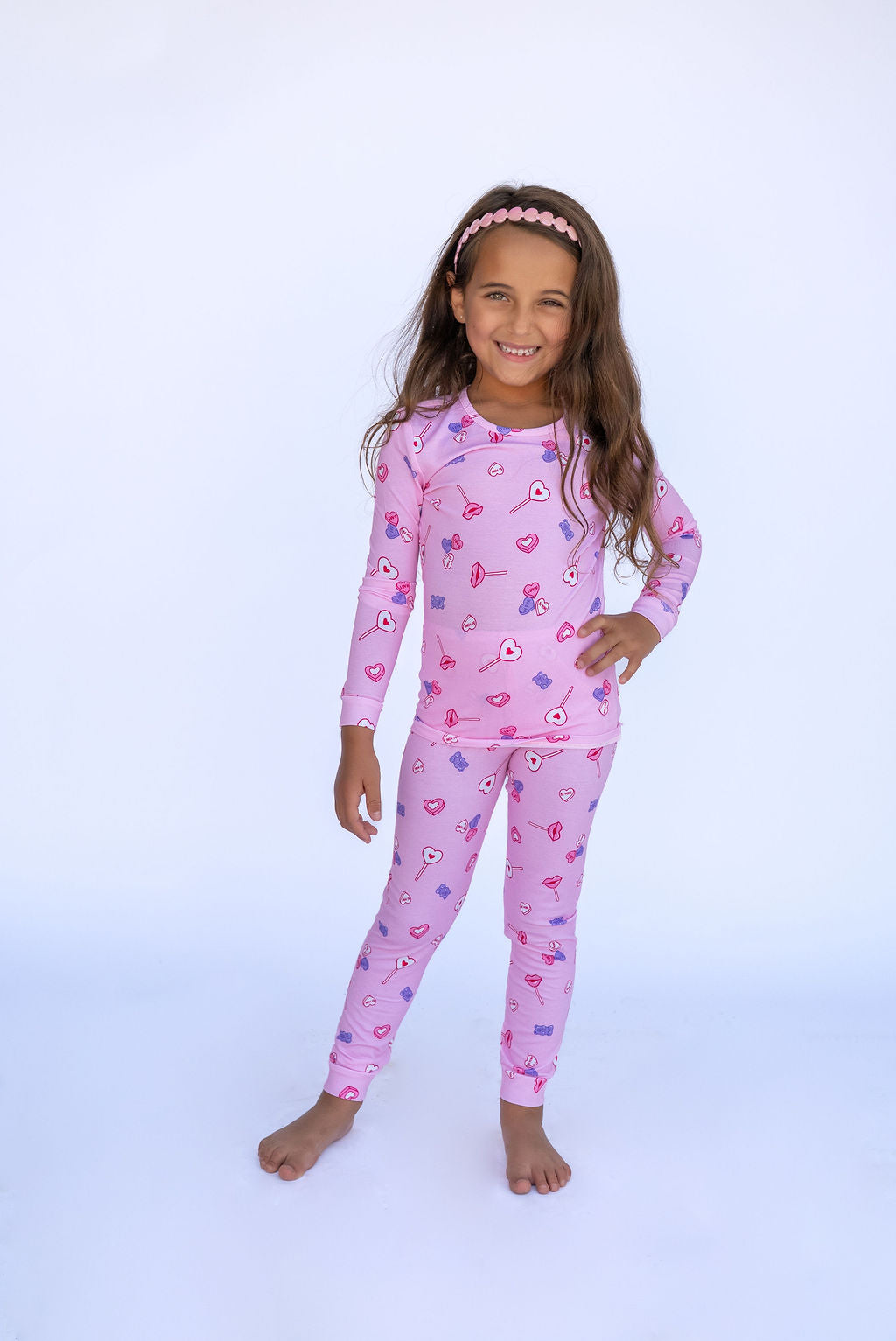 Girl in pink pajamas.