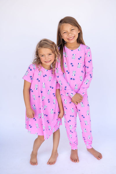 Two girls in matching PJ and dress